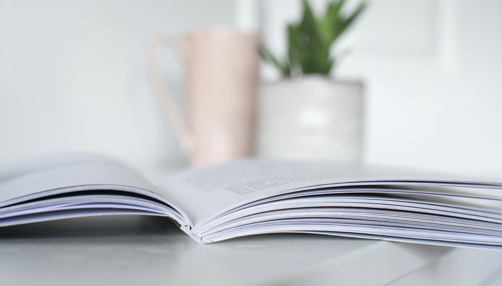 An open book on a table to define good mentees.