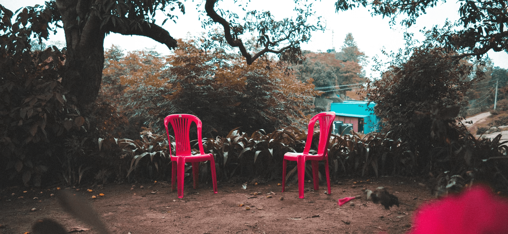 Red chairs on the ground ready for peer mentors.