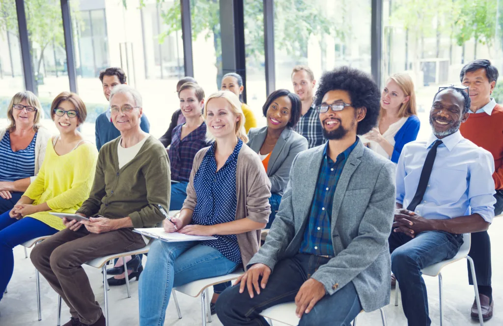 Multi-ethnic group of mentors and mentees in seminar