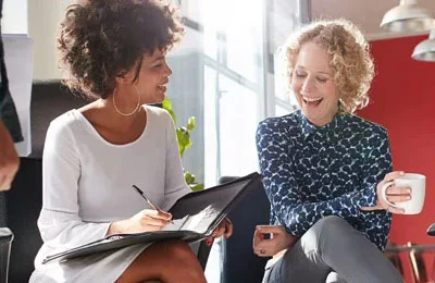 coworkers female chatting happy